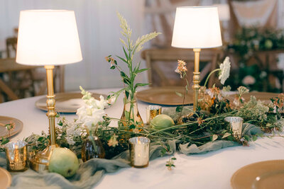 Beautiful wedding decor arragements on a table at the Mountain Shadow Farm rustic wedding venue
