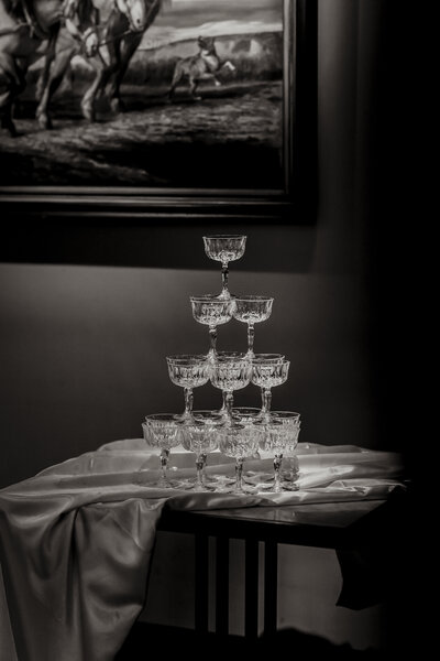 Champagne tower from beautiful glasses styled in an old castle on a wedding day
