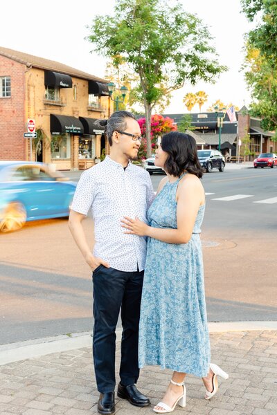 Couples standing in downtown pleasanton for engagement photos 