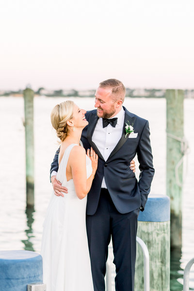 Newlyweds posing for photos on the White Elephant  docks