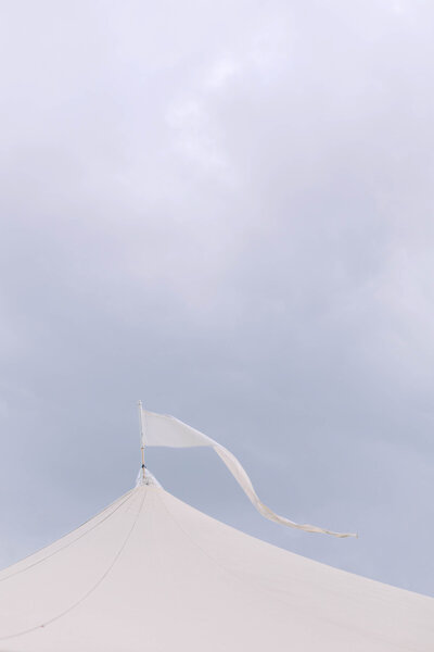 White wedding tent with flag on top