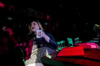 Girl Drinking Coffee in a Bar