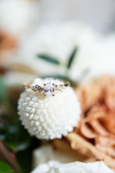 close up of a wedding ring on a flower