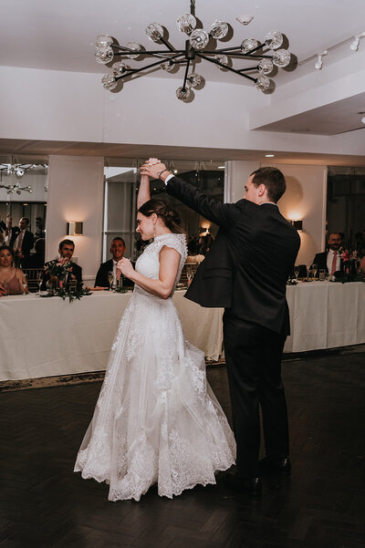 groom carrying his bride