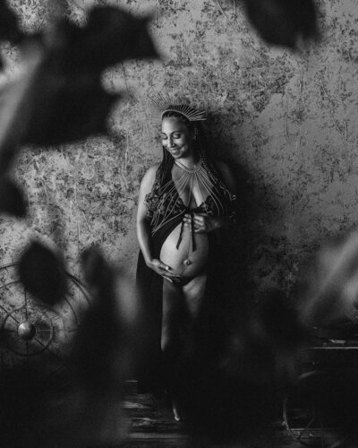black and white photo of a pregnant woman