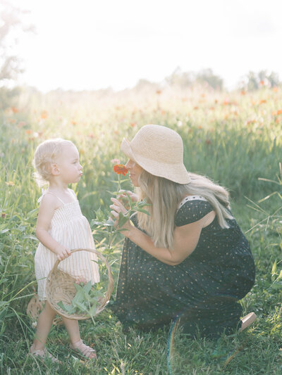 hands holding printed images by richmond family photographer