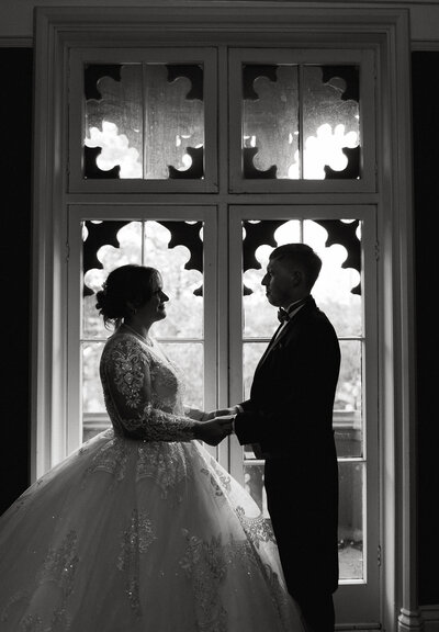 bride and groom holding hands