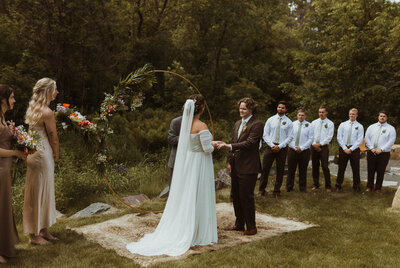 An intimate backyard wedding located in northern minnesota with all of the couples close friends and family. A brides boho dream come to life.