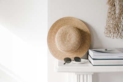 hat and books on a table