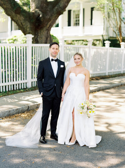 bride and groom in front of Gov. thomas bennett house
