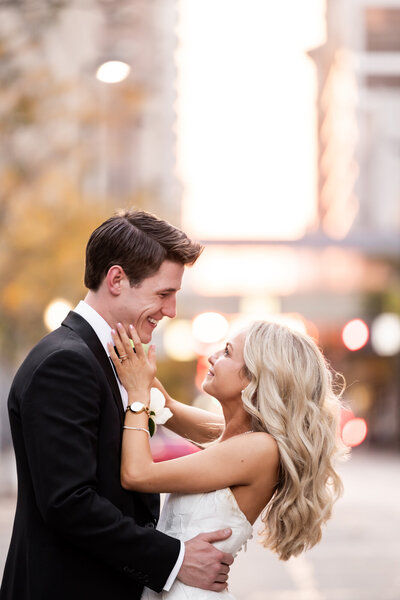 Experience the genuine joy and love shared by Cassandra and Jake in this captivating image captured at P&G Gardens before their elegant ceremony at the Cincinnati Club. The photo showcases the couple cuddling and laughing together, surrounded by the lush greenery of the gardens, perfectly encapsulating the bliss and excitement of their wedding day anticipation. Ideal for couples seeking a serene and romantic setting for their own pre-wedding photography.