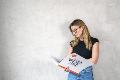 business photograph of lady reading a book