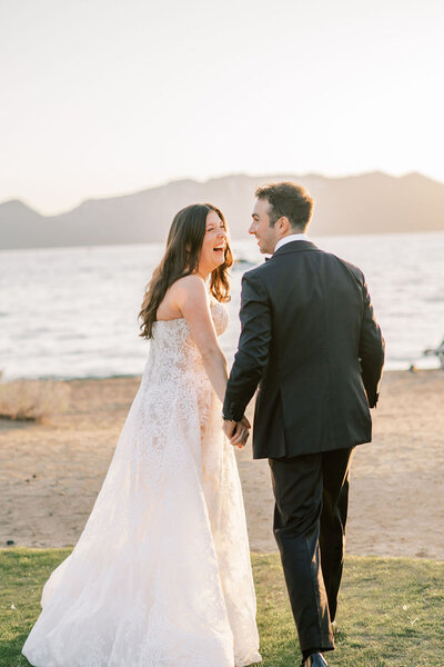 Bride and groom laughing in Lake Tahoe