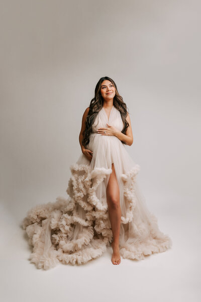 Portland pregnant mom stunning portrait wearing couture cream fluffy gown