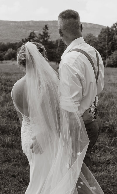 married couple kissing at sunset golden hour wedding day newlyweds hudson valley new york photographer