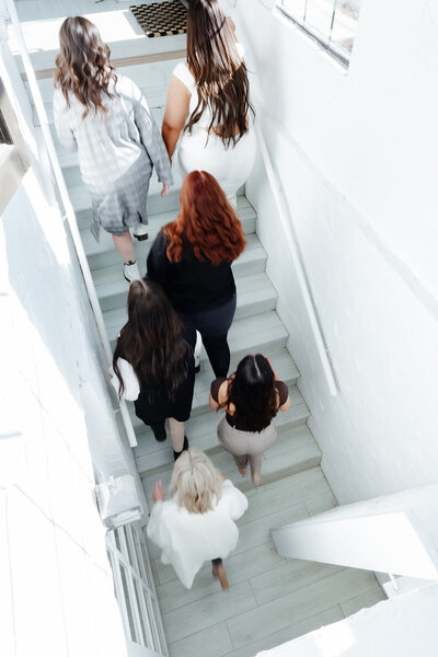 salon stylists walking up stairs