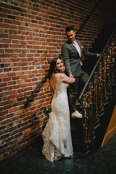 Wedding Photographers in Seattle capture a bride and groom at a venue overlooking ceremony site in Washington State