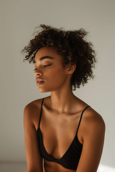 Woman closing eyes softly, representing personalized weight loss guidance and real support that is built for the individual needs.