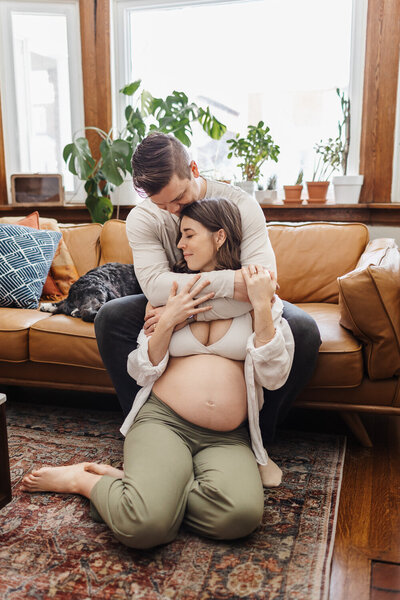 Cozy in home maternity session with family dog