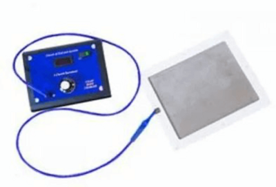 A small blue bioelectric zapper device connected by a wire to a flat metal plate, used in energy or frequency healing therapies.