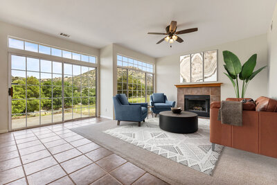 Livingroom with large windows. Virtually staged contemporary furniture.