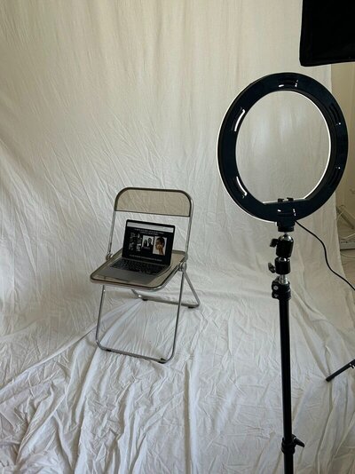 A laptop on a chair, with a custom Showit website template displayed on the screen.