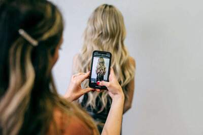 Sarah Jupin Taking Picture of Client's Hair for Instagram 1