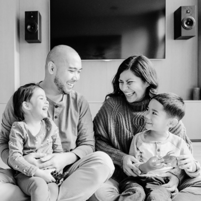 Black and white photo of family laughing