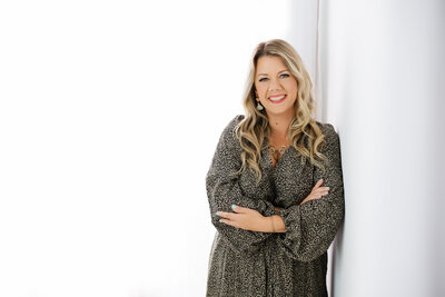 Photographer holding camera smiling in Harrisburg, PA