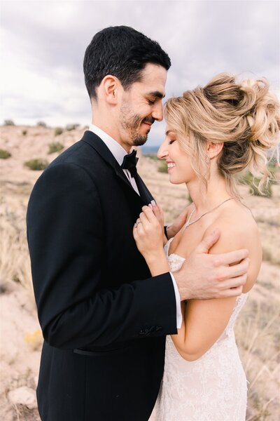 Bride and Groom walk down the aisle with a dusty blue, sage, and white bouquet at the St. Julien Hotel in Boulder, Colorado.