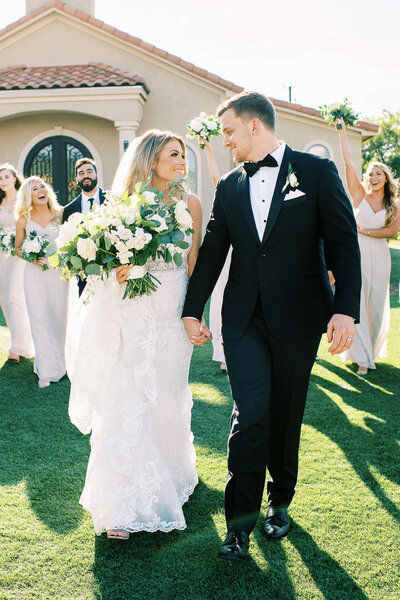 Bride and groom and wedding party celebrate the newly married couple at D'Vine Grace Vineyard