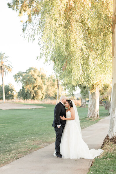 Bride and groom photographed at a golf course wedding