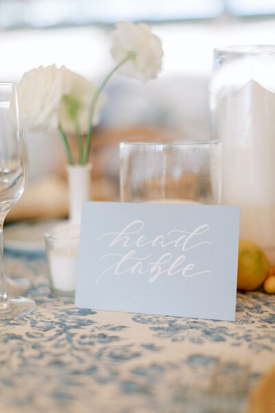 and lettered light blue head table sign  for wedding at Castle Hill Inn in Newport, Rhode Island