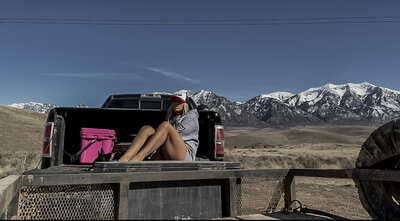 Brittney-Long-Sitting-on-Tailgate-in-Mtn-Ops-Hoodie