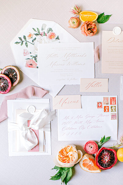 A invitation suite with flowers and citrus