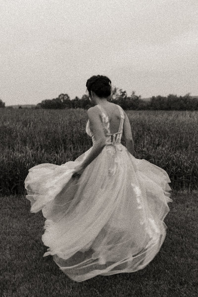 woman spinning around in her fairy wedding dress