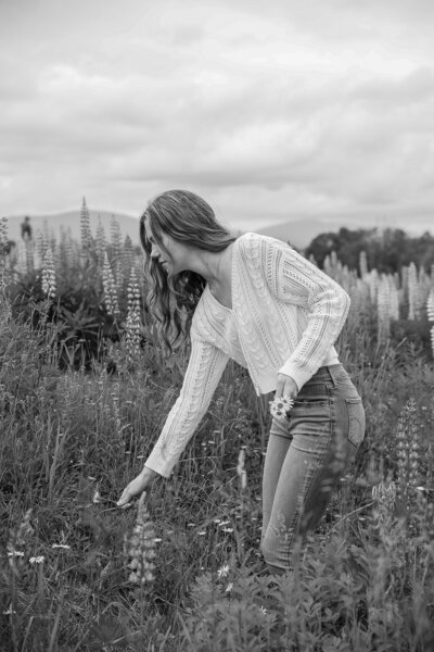 Photo of girl picking flowers | Senior Photography