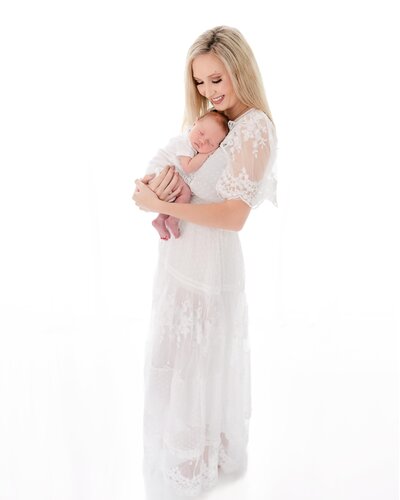 a beautiful bright simple photo of a mother and her new baby