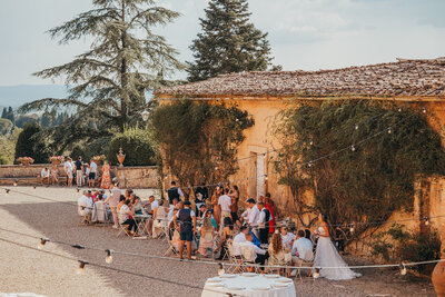 Wedding guest's congregate outside in Italy