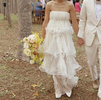 Bride holding a Sunrise Blooms bouquet 