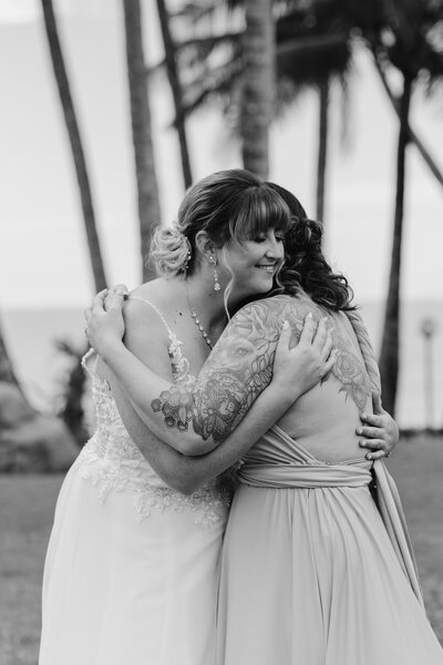 A couple romantically laughing and on the way to kiss with a golden sunset behind them, captured by Bendigo wedding photographer Tanya Strauss.