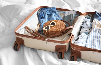 A suitcase full of DWD's favorite trip packing essentials from Amazon