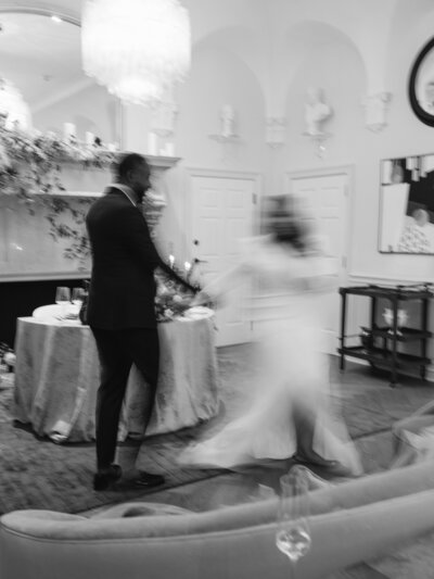 Motion photography of wedding couple dancing