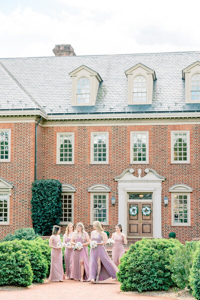 Luxury Wedding Photographer Atlanta | Bridesmaids In Lavender Dresses Walking At Estate Wedding Venue