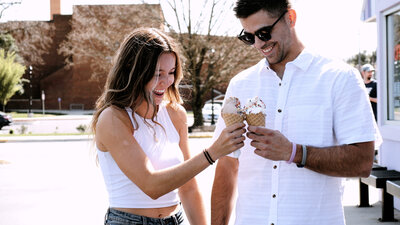 Husband and wife share an ice cream cone in Virginia