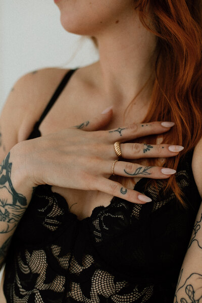 woman with tattoos in lingerie