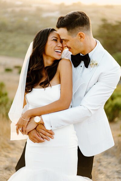 man hugging woman from behind