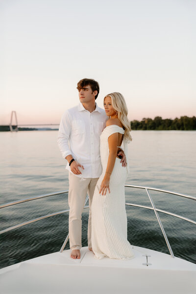 Engaged couple walking down steps of the Parthenon in Nashville, Tennessee
