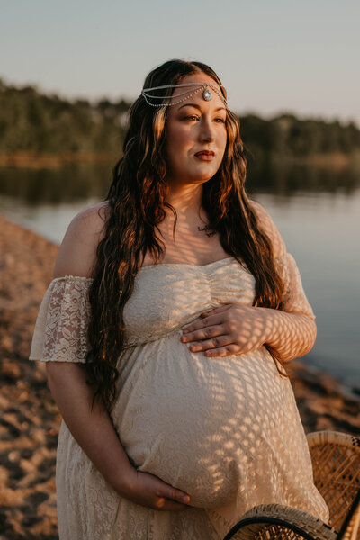 Surrogate maternity photo session during sunset at the beach.