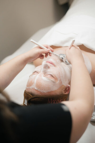 Close-up of facial cleanser being applied during facial service at Macayla Hopper Esthetics Hartselle